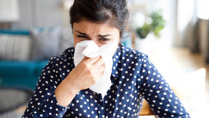 Woman suffering with severe allergies