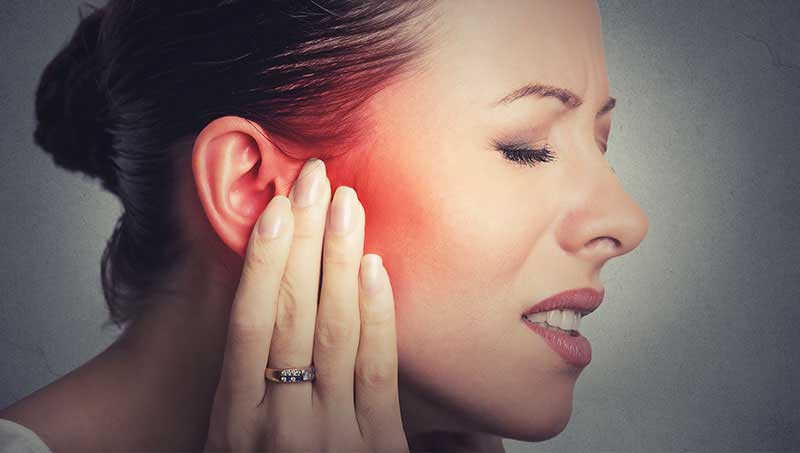 Woman suffering with severe inner ear infection